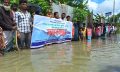 সুবর্ণচরে হাঁটু পানিতে দাঁড়িয়ে সড়ক সংস্কারের দাবিতে মানববন্ধন